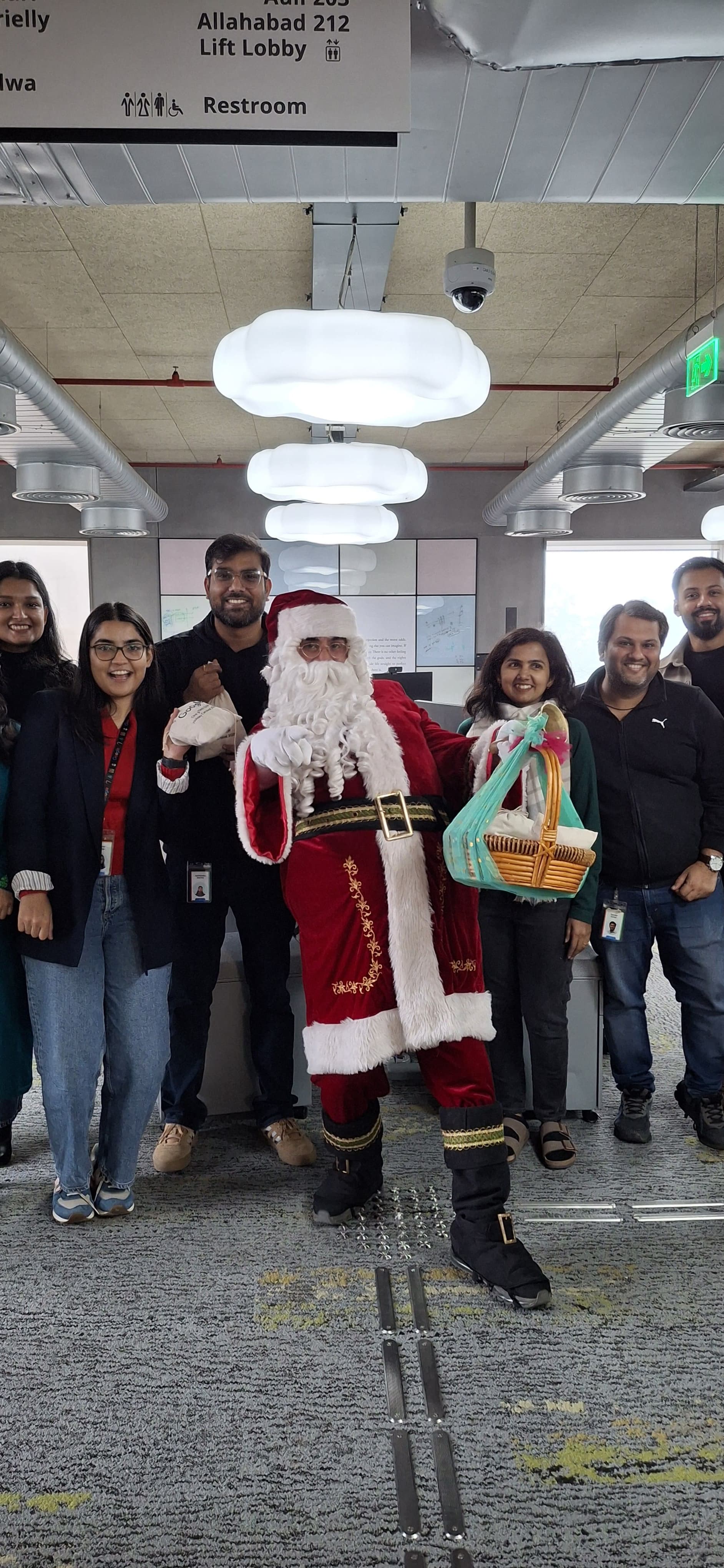 Santa greeting children at a warm indoor celebration